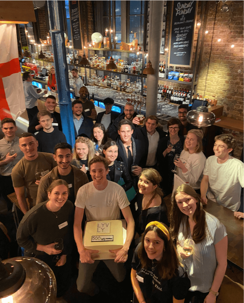group of people posing to picture during the party in the pub